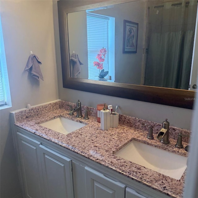 10004 Ethel St, Gibsonton, FL 33534 - bathroom featuring double vanity and a shower