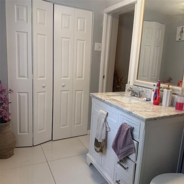 10004 Ethel St, Gibsonton, FL 33534 - bathroom featuring tile patterned flooring, vanity, and a closet
