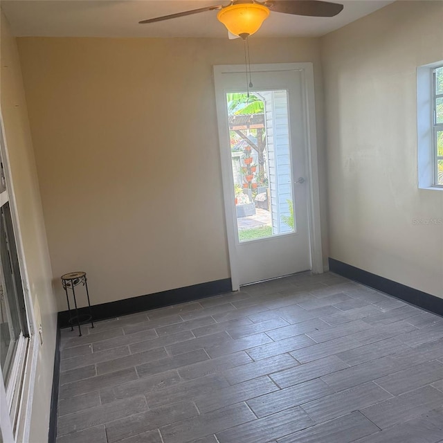 10004 Ethel St, Gibsonton, FL 33534 - unfurnished room with a ceiling fan, wood finish floors, and healthy amount of natural light