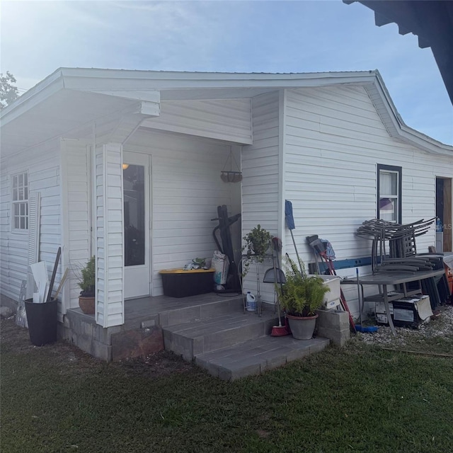 10004 Ethel St, Gibsonton, FL 33534 - back of house featuring a yard