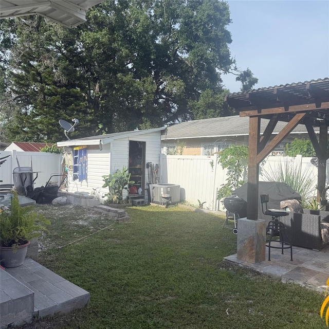 10004 Ethel St, Gibsonton, FL 33534 - fenced backyard with an outdoor structure, a patio, and a pergola