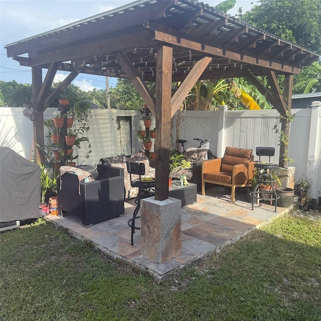 10004 Ethel St, Gibsonton, FL 33534 - fenced backyard featuring a pergola, outdoor lounge area, and a patio area