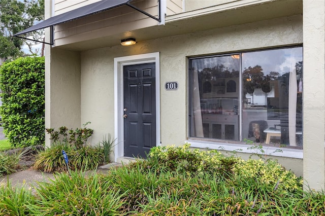 4905 25th St W Unit 101, Bradenton, FL 34207 - property entrance featuring stucco siding