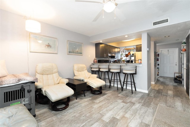 4905 25th St W Unit 101, Bradenton, FL 34207 - living area featuring light wood-type flooring and a ceiling fan