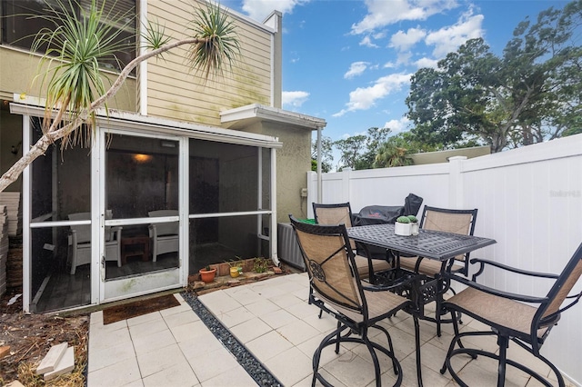 4905 25th St W Unit 101, Bradenton, FL 34207 - view of patio / terrace featuring outdoor dining space and a sunroom