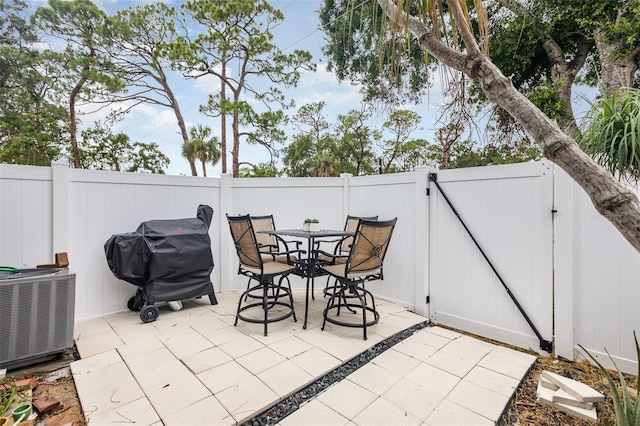 4905 25th St W Unit 101, Bradenton, FL 34207 - fenced backyard featuring a gate, a patio, grilling area, and outdoor dining area