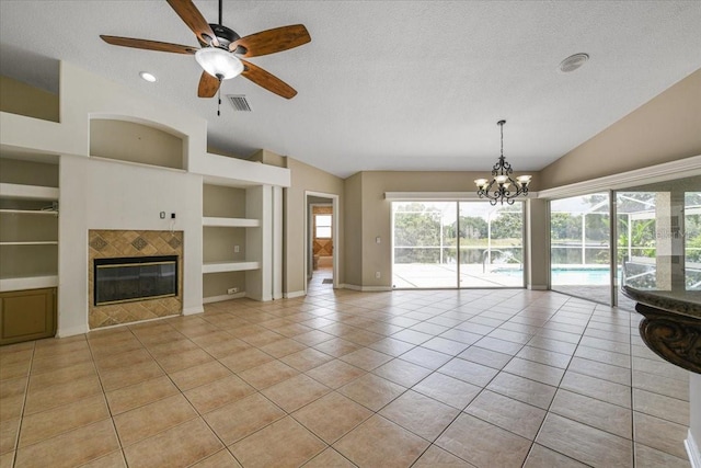 816 Sandringham Ln, Lutz, FL 33549 - unfurnished living room with lofted ceiling, a tiled fireplace, built in features, light tile patterned floors, and a ceiling fan