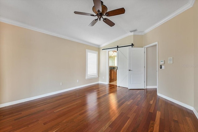 816 Sandringham Ln, Lutz, FL 33549 - unfurnished bedroom with a barn door, lofted ceiling, dark wood-type flooring, ornamental molding, and ceiling fan