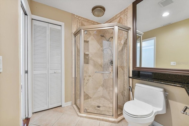 816 Sandringham Ln, Lutz, FL 33549 - bathroom with a closet, a shower stall, and tile patterned floors