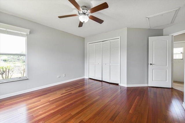816 Sandringham Ln, Lutz, FL 33549 - unfurnished bedroom featuring multiple windows, a closet, wood-type flooring, and ceiling fan