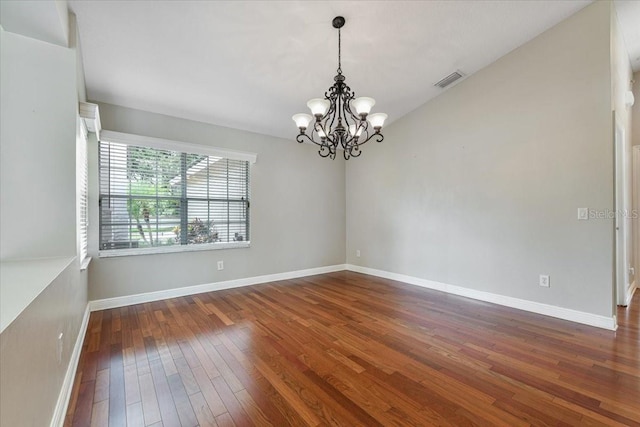 816 Sandringham Ln, Lutz, FL 33549 - spare room with a chandelier and hardwood / wood-style flooring