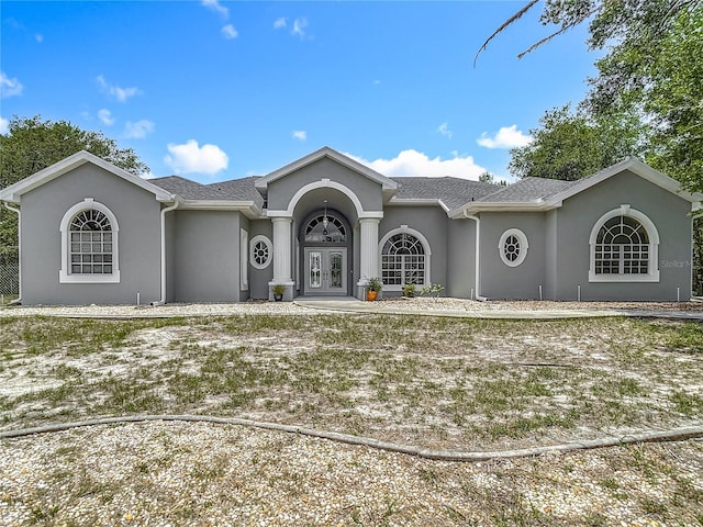 8303 Nightwalker Rd, Weeki Wachee, FL 34613 - ranch-style house featuring french doors and stucco siding