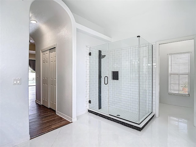 8303 Nightwalker Rd, Weeki Wachee, FL 34613 - full bath featuring a stall shower and tile patterned flooring