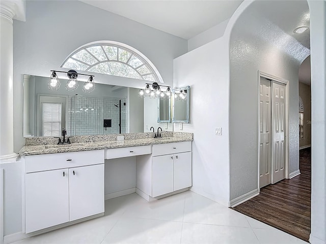 8303 Nightwalker Rd, Weeki Wachee, FL 34613 - full bathroom featuring double vanity, tiled shower, and tile patterned flooring