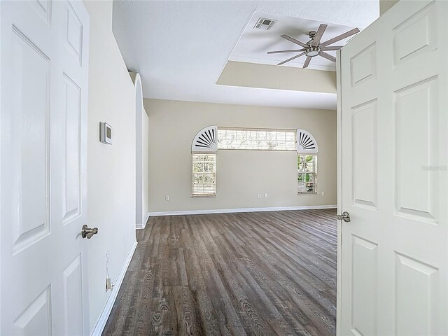 8303 Nightwalker Rd, Weeki Wachee, FL 34613 - spare room with a ceiling fan and dark wood finished floors