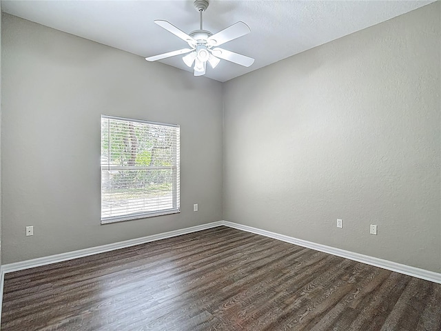 8303 Nightwalker Rd, Weeki Wachee, FL 34613 - empty room with dark wood-style flooring and ceiling fan