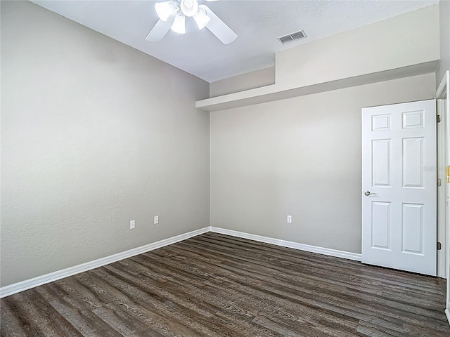 8303 Nightwalker Rd, Weeki Wachee, FL 34613 - unfurnished room featuring dark wood-type flooring and a ceiling fan
