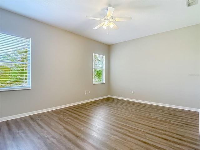 8303 Nightwalker Rd, Weeki Wachee, FL 34613 - unfurnished room with wood finished floors and ceiling fan