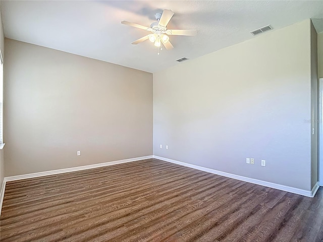 8303 Nightwalker Rd, Weeki Wachee, FL 34613 - spare room with dark wood-type flooring and a ceiling fan