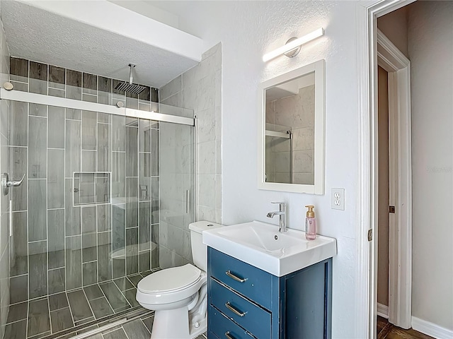 8303 Nightwalker Rd, Weeki Wachee, FL 34613 - full bath with vanity, a shower stall, and a textured ceiling