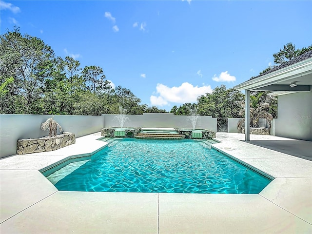 8303 Nightwalker Rd, Weeki Wachee, FL 34613 - view of swimming pool featuring a patio and a pool with connected hot tub