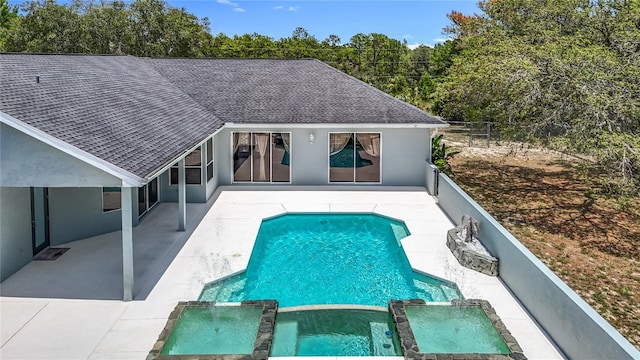 8303 Nightwalker Rd, Weeki Wachee, FL 34613 - view of pool with a patio area, a pool with connected hot tub, and a fenced backyard