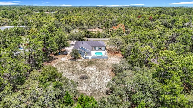 8303 Nightwalker Rd, Weeki Wachee, FL 34613 - aerial view of property and surrounding area with a heavily wooded area