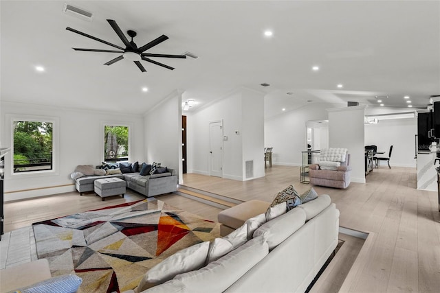 900 Oak Hollow Pl, Brandon, FL 33510 - living area featuring recessed lighting, a ceiling fan, vaulted ceiling, light wood finished floors, and ornamental molding