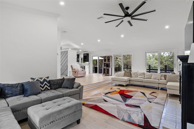 900 Oak Hollow Pl, Brandon, FL 33510 - living room featuring a ceiling fan, recessed lighting, light wood-type flooring, lofted ceiling, and ornamental molding