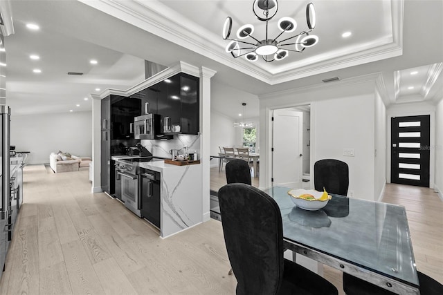 900 Oak Hollow Pl, Brandon, FL 33510 - dining room with a chandelier, light wood finished floors, crown molding, a tray ceiling, and recessed lighting