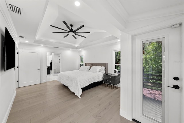 900 Oak Hollow Pl, Brandon, FL 33510 - bedroom featuring a raised ceiling, light wood-style floors, ornamental molding, recessed lighting, and access to exterior