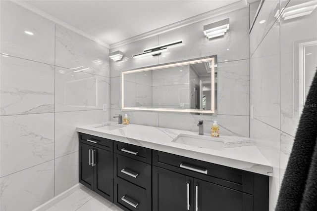 900 Oak Hollow Pl, Brandon, FL 33510 - bathroom featuring tile walls, ornamental molding, double vanity, and marble finish flooring