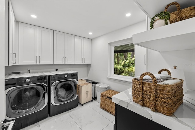 900 Oak Hollow Pl, Brandon, FL 33510 - laundry area featuring separate washer and dryer, cabinet space, light marble finish flooring, and recessed lighting