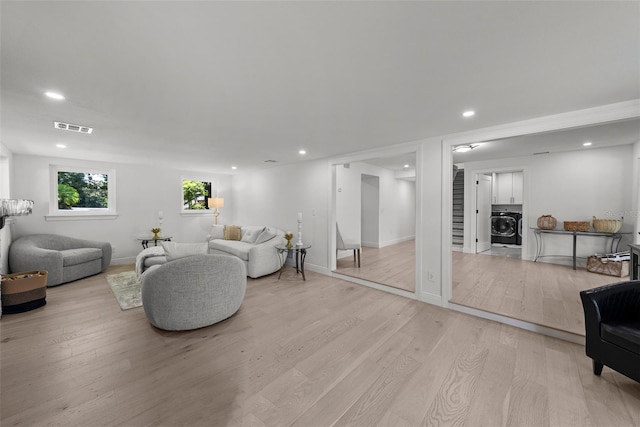 900 Oak Hollow Pl, Brandon, FL 33510 - living room with washer / dryer, light wood-type flooring, and recessed lighting