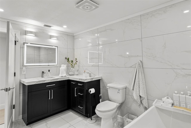 900 Oak Hollow Pl, Brandon, FL 33510 - full bath featuring double vanity, marble look tile flooring, tile walls, a soaking tub, and crown molding