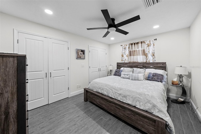 900 Oak Hollow Pl, Brandon, FL 33510 - bedroom featuring multiple closets, dark wood finished floors, recessed lighting, and ceiling fan