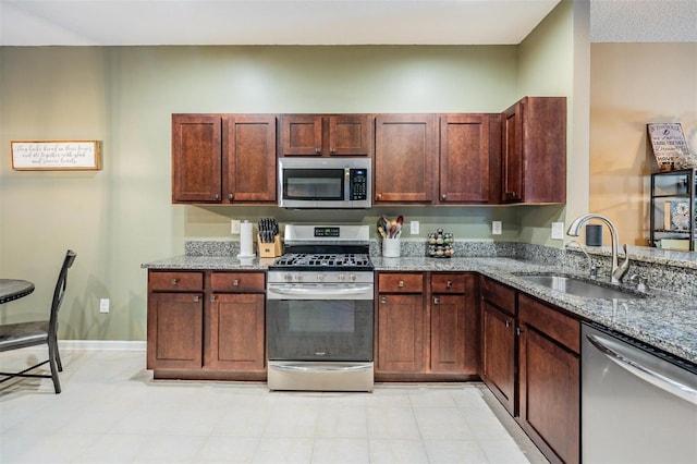 19351 Haskell Pl, Land O Lakes, FL 34638 - kitchen featuring appliances with stainless steel finishes and light stone counters