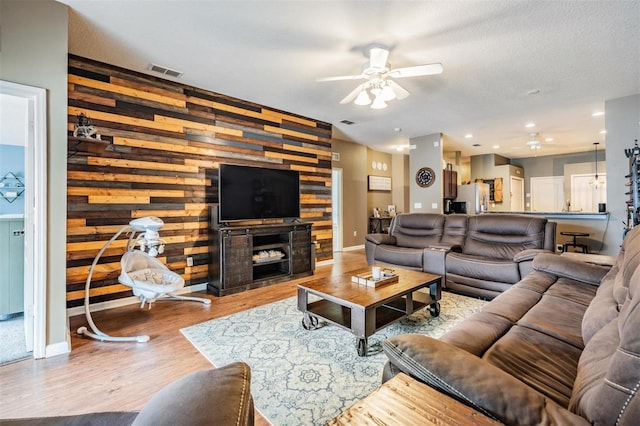 19351 Haskell Pl, Land O Lakes, FL 34638 - living room featuring ceiling fan and wood finished floors