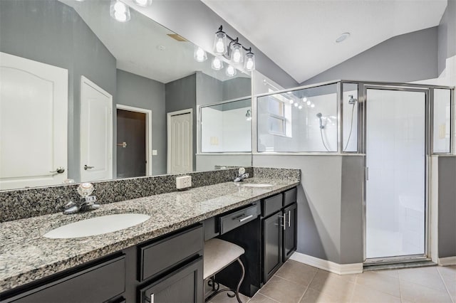 19351 Haskell Pl, Land O Lakes, FL 34638 - full bath with double vanity, a stall shower, tile patterned flooring, and lofted ceiling