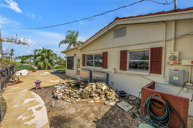 557 Crystal Dr, Madeira Beach, FL 33708 - view of side of home with board and batten siding