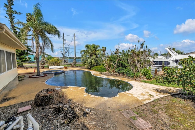 557 Crystal Dr, Madeira Beach, FL 33708 - view of swimming pool with a patio and a pool with connected hot tub