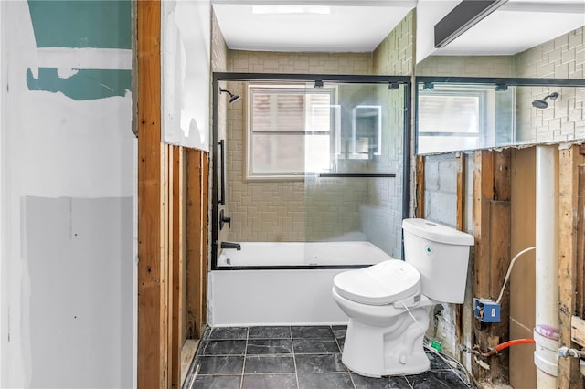 557 Crystal Dr, Madeira Beach, FL 33708 - full bathroom featuring plenty of natural light and bath / shower combo with glass door