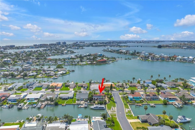 557 Crystal Dr, Madeira Beach, FL 33708 - aerial perspective of suburban area featuring a nearby body of water