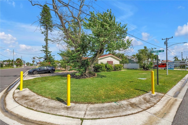 557 Crystal Dr, Madeira Beach, FL 33708 - view of front facade featuring a front yard