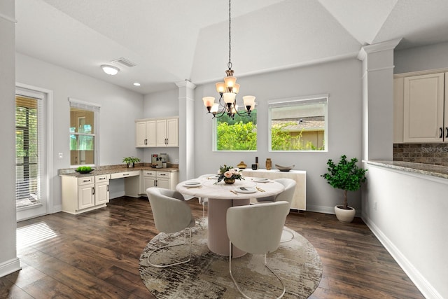 1304 Lorea Ln, Brandon, FL 33511 - dining space with decorative columns, a chandelier, dark wood finished floors, lofted ceiling, and recessed lighting