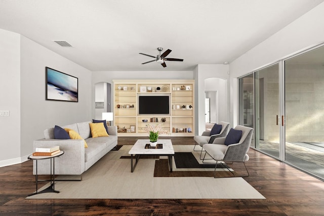 1304 Lorea Ln, Brandon, FL 33511 - living room with arched walkways, ceiling fan, and wood finished floors