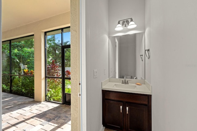 1304 Lorea Ln, Brandon, FL 33511 - bathroom featuring vanity and brick patterned flooring