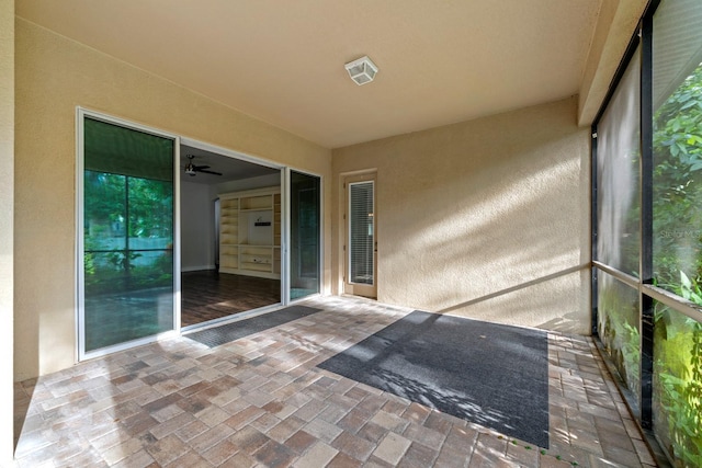 1304 Lorea Ln, Brandon, FL 33511 - unfurnished sunroom with brick floors