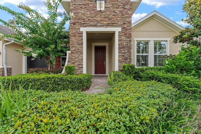 1304 Lorea Ln, Brandon, FL 33511 - doorway to property featuring stone siding and stucco siding