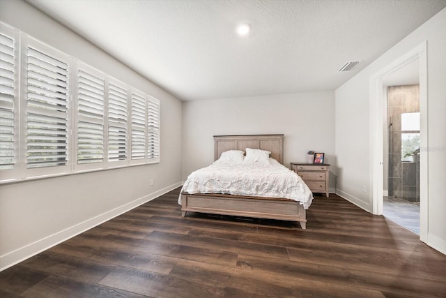 2516 Cobalt Shores Ln, Clearwater, FL 33761 - bedroom featuring dark wood finished floors and multiple windows